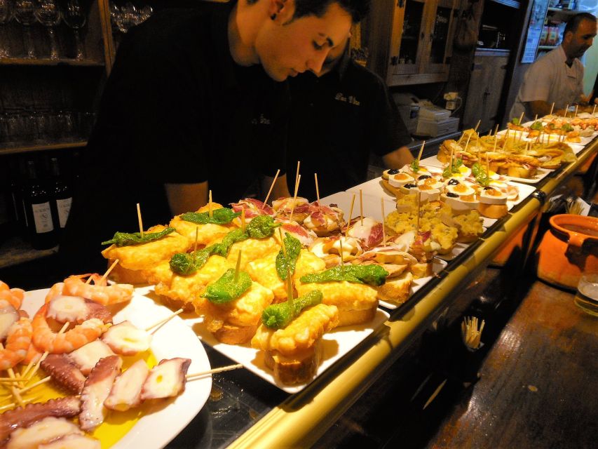 Barcelona: Evening Walking Tour in the Gaudi Area with Tapas - L’Eixample at night, with Modernisme overhead