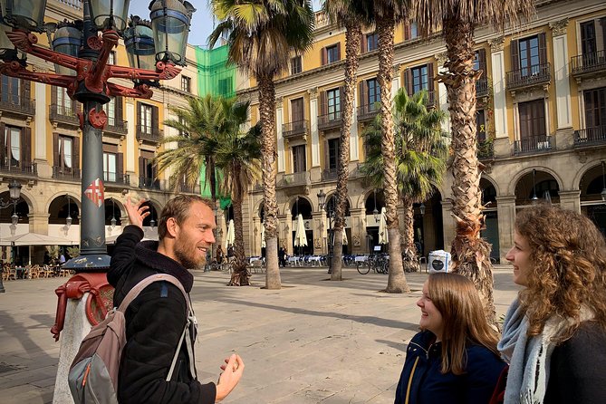 Ramblas, Old Town, Gothic and Gaudi Architecture Walking Tour - Plaça Reial adds arcades, palms, and evening energy